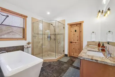 a bathroom with a shower and a toilet and a sink at Evergreen Getaway Pet Friendly in SLT w Hot Tub in South Lake Tahoe