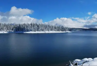 a large body of water with snow covered trees at Kokanee Hideaway-Family Friendly 5BR Epic Game Room in Shaver Lake
