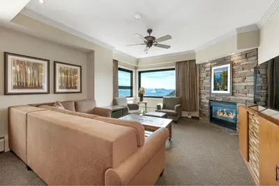 a living room with a couch and a fireplace at Enjoy the Ridge Tahoe Two-Bedroom Lock-Off for a family of 6 in Stateline