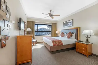 a hotel room with a bed and a window at Enjoy the Ridge Tahoe Two-Bedroom Lock-Off for a family of 6 in Stateline