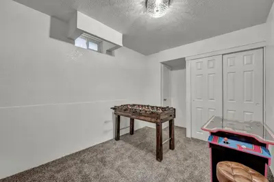 a room with a foosball table in front of a door at New-Near Midtown-HotTub-Firepit-Arlington Manor in Reno