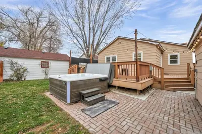 a backyard with a hot tub and a house at New-Near Midtown-HotTub-Firepit-Arlington Manor in Reno