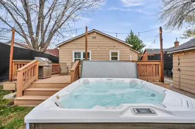 a hot tub in the backyard of a house at New-Near Midtown-HotTub-Firepit-Arlington Manor in Reno