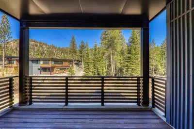 a view from the front porch of a house at Starfall Run at Palisades by Tahoe Getaways - Luxury 3BR w Ski Shuttle, A/C & Bonus Room! in Alpine Meadows