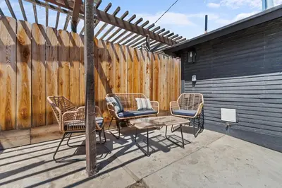 a group of chairs and a table on a patio at Boho Chic Dt Visalia W Modern Art Flair in Visalia