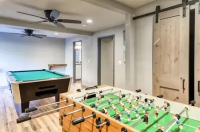 a room with a pool table and a ceiling fan at Villager in the Heart of Shaver Family Friendly in Shaver Lake