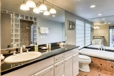 a bathroom with a sink and a tub and a toilet at Villager in the Heart of Shaver Family Friendly in Shaver Lake