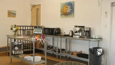 a kitchen with a counter top with a microwave and acomputer at Cedar Springs Retreats in North Fork