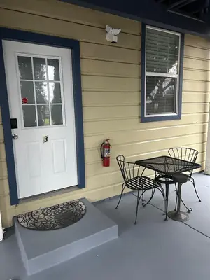 a patio with two chairs and a table next to a door at Luxe Cozy 1 bedroom 1 bathroom near downtown in Sacramento
