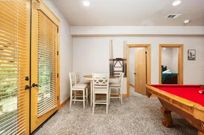 a room with a ping pong table and a pool table at Sierra Pines- Family friendly Game Room & Fire Pit in Shaver Lake
