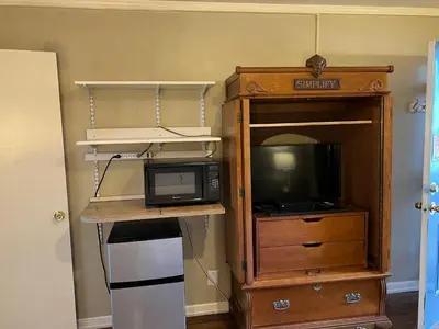 a small kitchen with a microwave and a microwave at Lariat Motel in Sparks