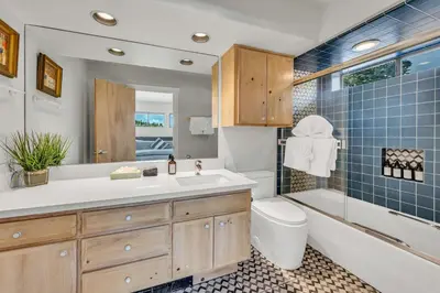 a bathroom with a sink and a tub and a toilet at Northstar Fairway Hot Tub Retreat in Truckee
