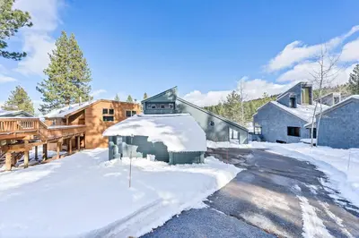 a house with snow on the ground in a yard at Northstar Fairway Hot Tub Retreat in Truckee