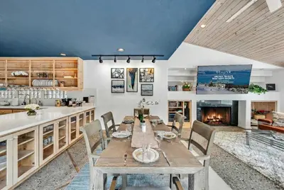 a dining room with a table and a fireplace at Northstar Fairway Hot Tub Retreat in Truckee