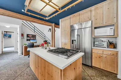a kitchen with a stove and a refrigerator at Northstar Fairway Hot Tub Retreat in Truckee