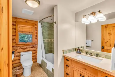 a bathroom with a toilet sink and a shower at Lake Tahoe Haven Private Hot Tub Deck in Tahoma