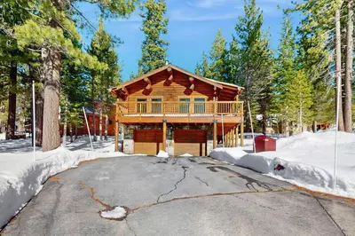 a log cabin in the woods in the snow at Adventure Ridge Cabin in Truckee