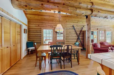 a dining room with a table and chairs at Adventure Ridge Cabin in Truckee