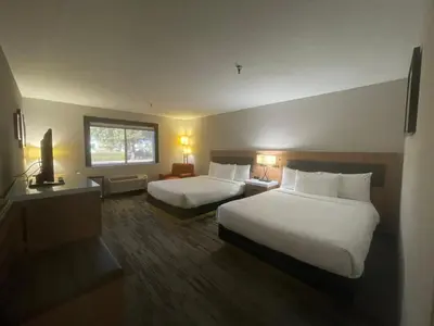 a hotel room with two beds and a window at Sisk Hotel in Modesto