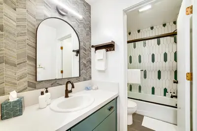 a bathroom with a sink and a mirror at 2 Mi to Eagle Lodge! Multi-Level Haven with Hot Tub in Mammoth Lakes