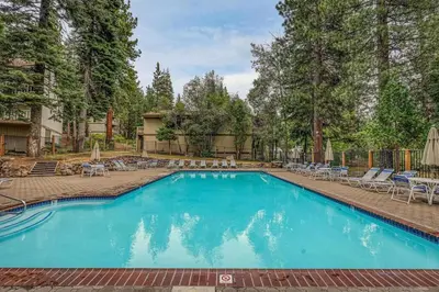 a large swimming pool with chairs at Kingswood Pines in Kings Beach