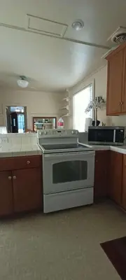 a kitchen with a white stove top oven at Historic Reno Home in Reno