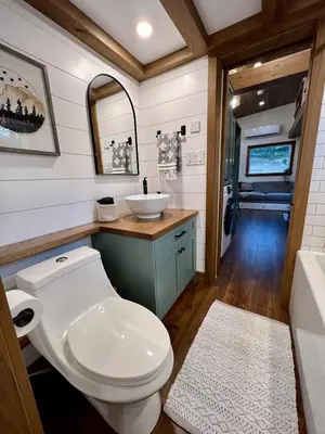 a bathroom with a toilet and a sink at Tiny Rustic at Yosemite Gateway in Groveland
