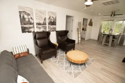 a living room with a couch and two chairs at Yosemite Gateway home in Groveland in Groveland
