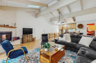 a living room with a couch and a table at The Treetop Retreat in Incline Village