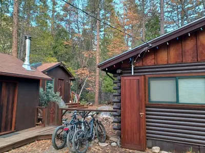 a group of bikes parked outside of a cabin at 45R Camp Duke in North Wawona