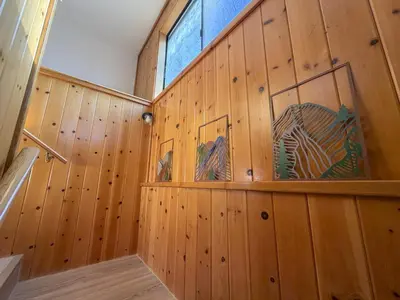 a wooden room with wooden walls and a window at Boat Dock - Lake Front - Dog Friendly - Sleeps 7 in Bass Lake