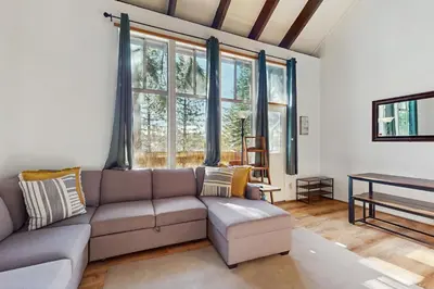 a living room with a couch and a table at Fireside at Tahoe City in Tahoe City