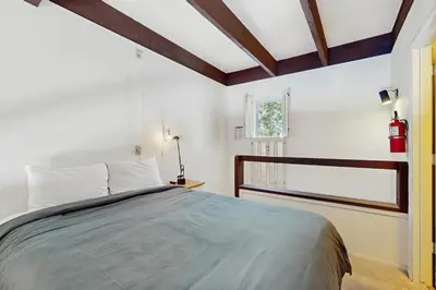 a bedroom with a large bed and a window at Fireside at Tahoe City in Tahoe City