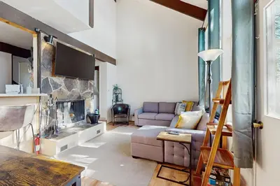 a living room with a couch and a fireplace at Fireside at Tahoe City in Tahoe City