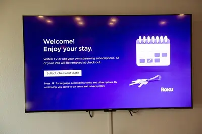a television screen with a sign that says welcome to enjoy your stay at New Modern 3bed in North Merced 5 Star hosts in Merced