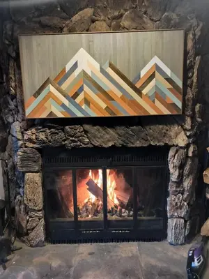 a fireplace with a painting on top of it at Tahoe Thunderbird Suite with Fireplace in South Lake Tahoe