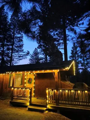 a house with christmas lights on it at night at Tahoe Thunderbird Suite with Fireplace in South Lake Tahoe