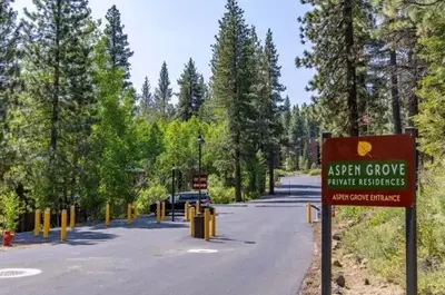 a sign in the middle of a road with trees at Northstar Studio near village and slopes in Truckee