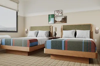 a bedroom with two beds and a window at Outbound Yosemite in Oakhurst