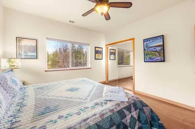 a bedroom with a bed and a ceiling fan at Lookout Point - Retreat for 6 in South Lake Tahoe