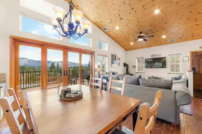 a living room with a table and a couch at Lookout Point - Retreat for 6 in South Lake Tahoe