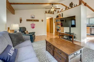a living room with a couch and a tv at 5 Mi to Heavenly Resort Cozy Home with Fenced Yard in South Lake Tahoe