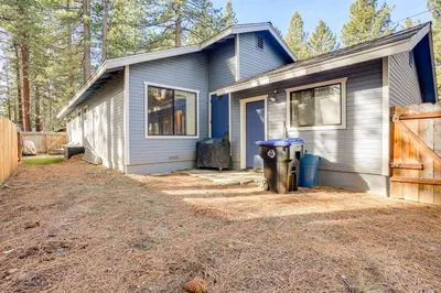 a house with a trash can in front of it at 5 Mi to Heavenly Resort Cozy Home with Fenced Yard in South Lake Tahoe