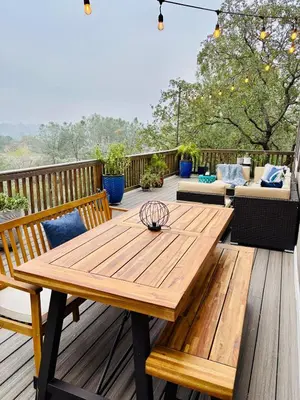 a wooden table and benches on a deck at Canyon Ridge Retreat in Folsom