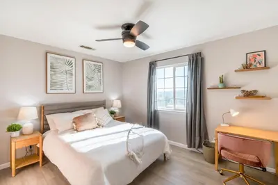 a bedroom with a bed and a desk at Cold Plunge, Hot Tub, Firepit, BBQ, Pet-Friendly, Sunset Views near Yosemite in Coarsegold