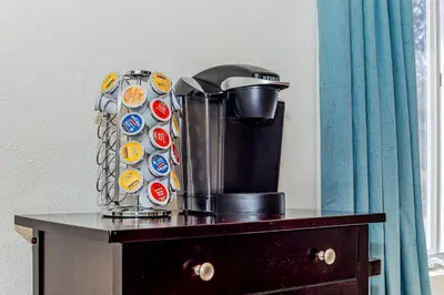 a coffee maker sitting on top of a table at Skyfalls Retreat Mid-Century Guesthouse near Yosemite in Oakhurst