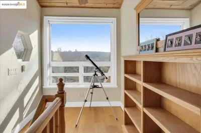 a camera on a tripod in a room with a window at 7 br Mega home near Yosemite Spacious, Game Room in Groveland