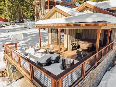 a house with snow on the roof at Lakeview Luxury Retreat with Hot Tub and Game Room in Carnelian Bay