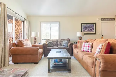 a living room with two couches and a coffee table at Forest Meadows 8 in Mammoth Lakes