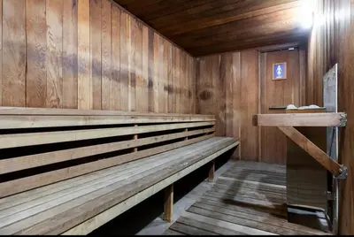 a sauna with wooden walls and a wooden bench at Mammoth Creek 36 in Mammoth Lakes